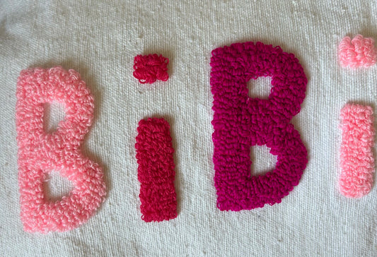 ZOOM SUR LE dégradé de rose et le motif bouclette