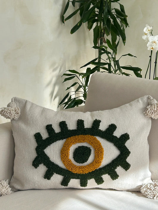 housse de coussin en laine tissée avec un oeil vert au centre, artisanale 